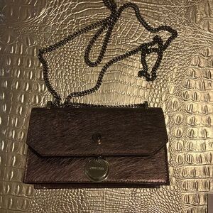 New, never used Beautiful light purple authentic Jimmy Choo purse.